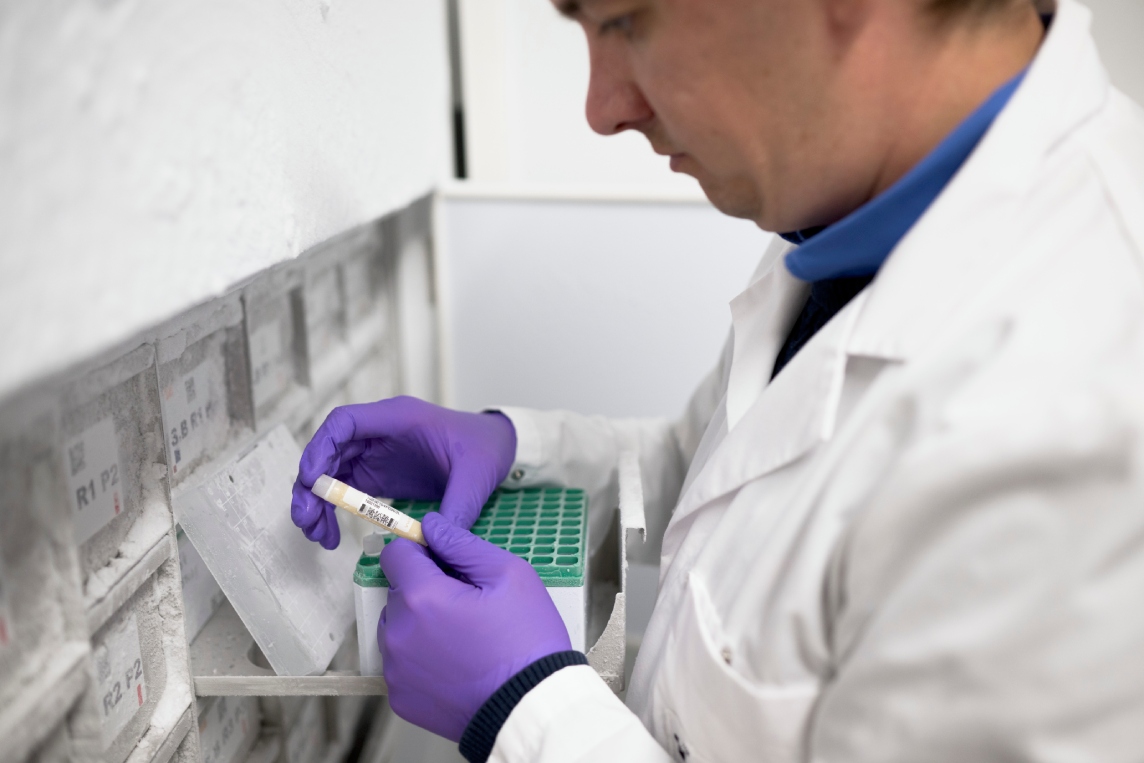 Scientist checking samples from the -80 degree celsius freezer.
