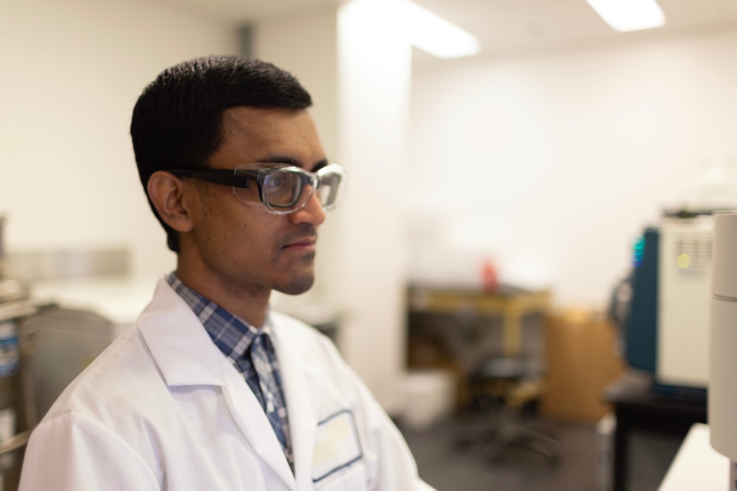 Scientist reviewing Ella™ clinical application data in a laboratory