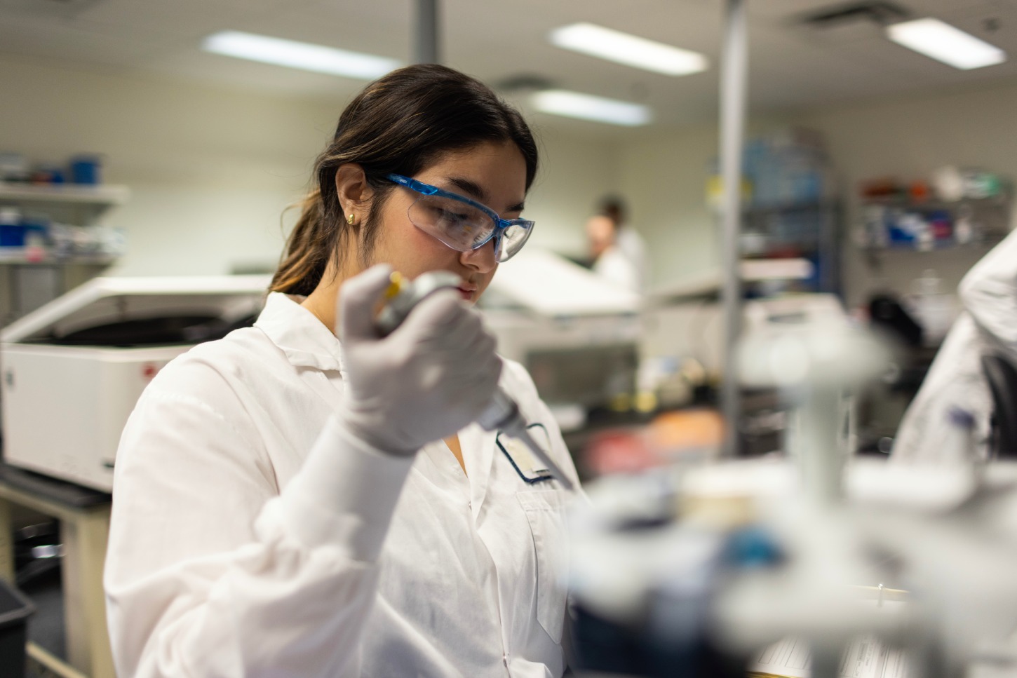 Scientist conducting CyTOF immune cell population analysis in clinical laboratory