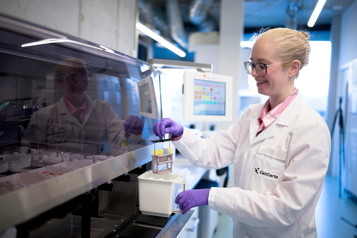 Scientist handling samples for imaging.