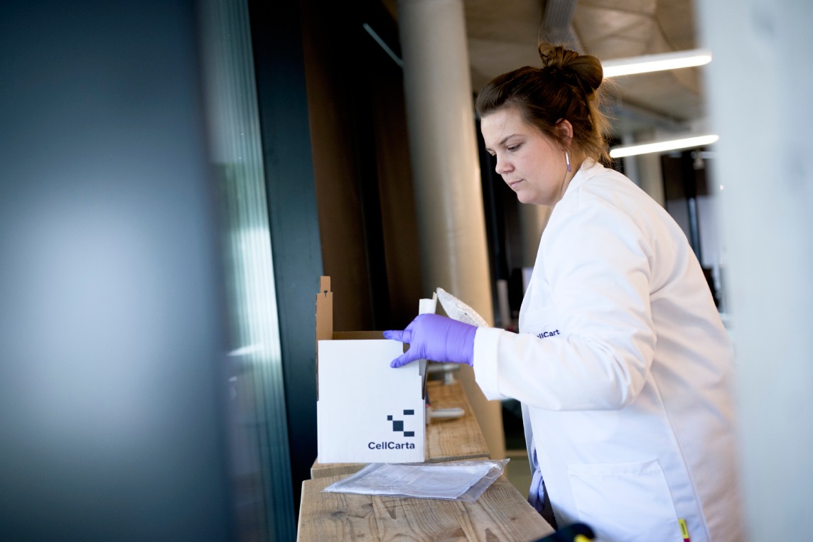 Quality control scientist reviewing CyTOF mass cytometry results in GCLP-compliant laboratory