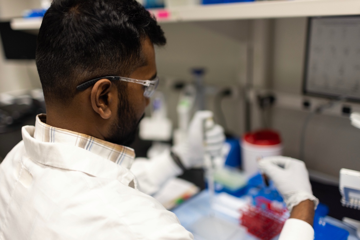 Scientist measuring biomarker concentrations with ELISA