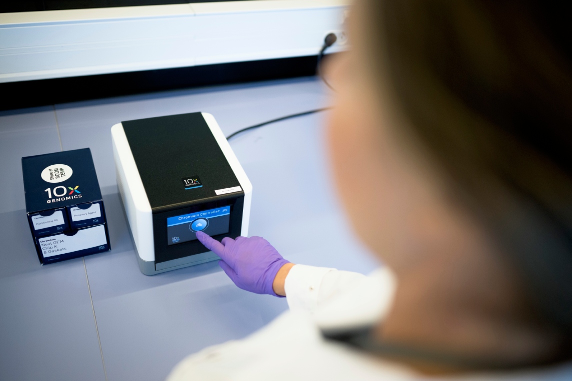 Loading a sample into the 10X Genomics Chromium instrument.