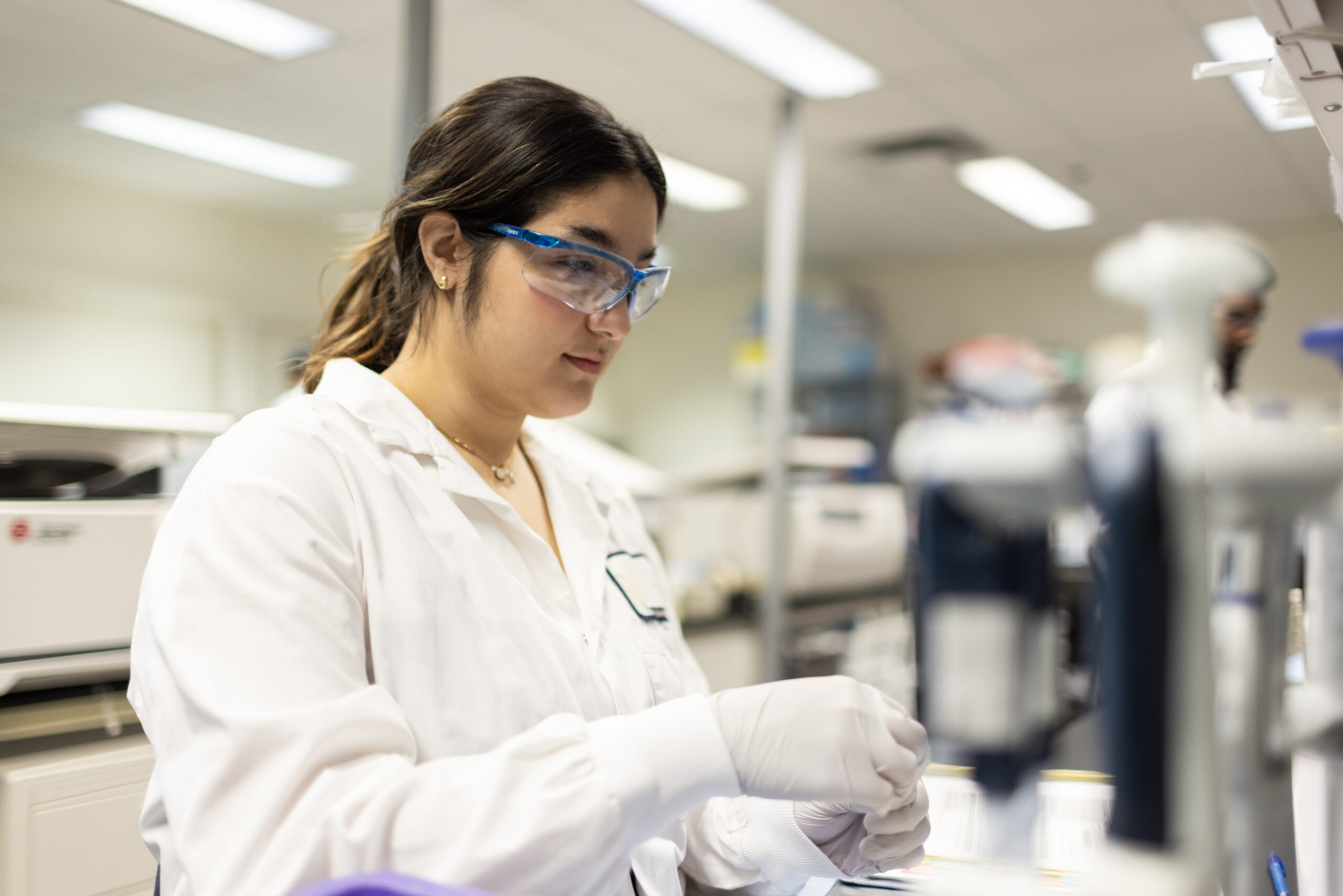 Scientist working at a laboratory bench.