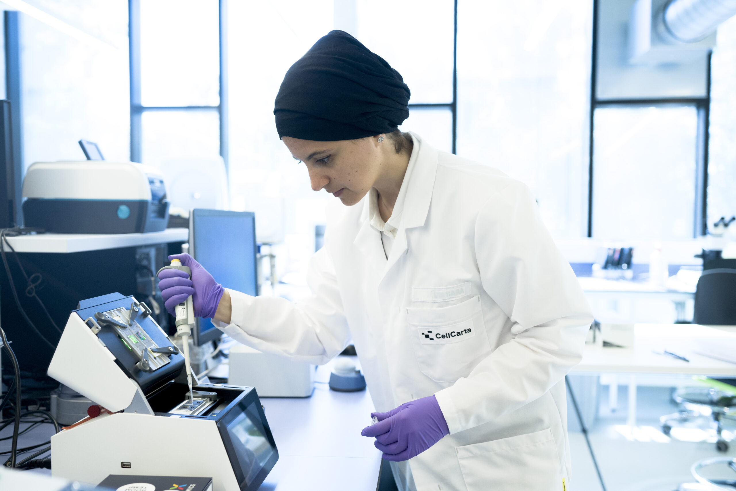Scientist loading samples for single cell sequencing.