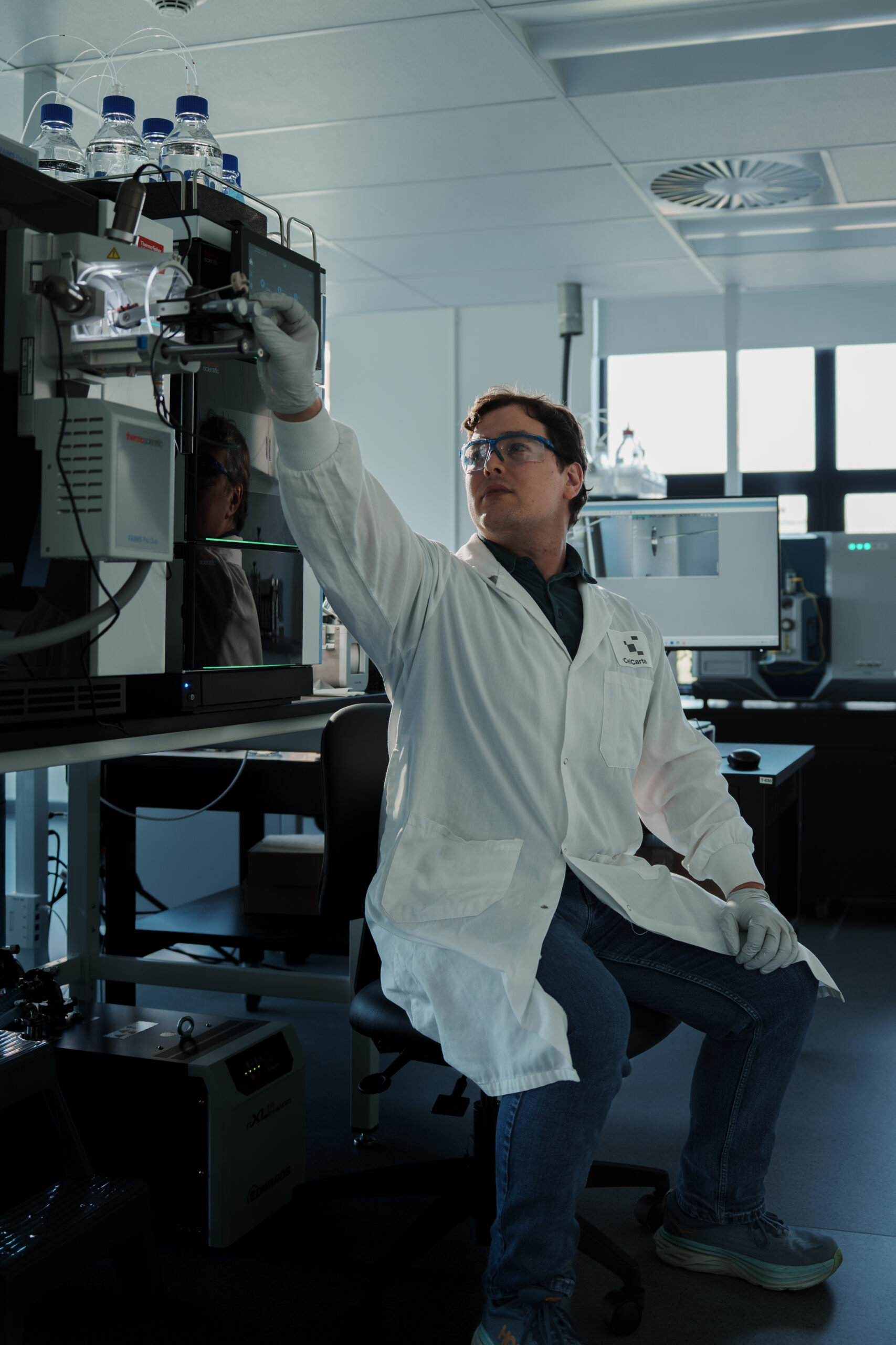 CellCarta proteomics scientist operating LC-MS/MS instruments for multiplexed biomarker quantification and discovery