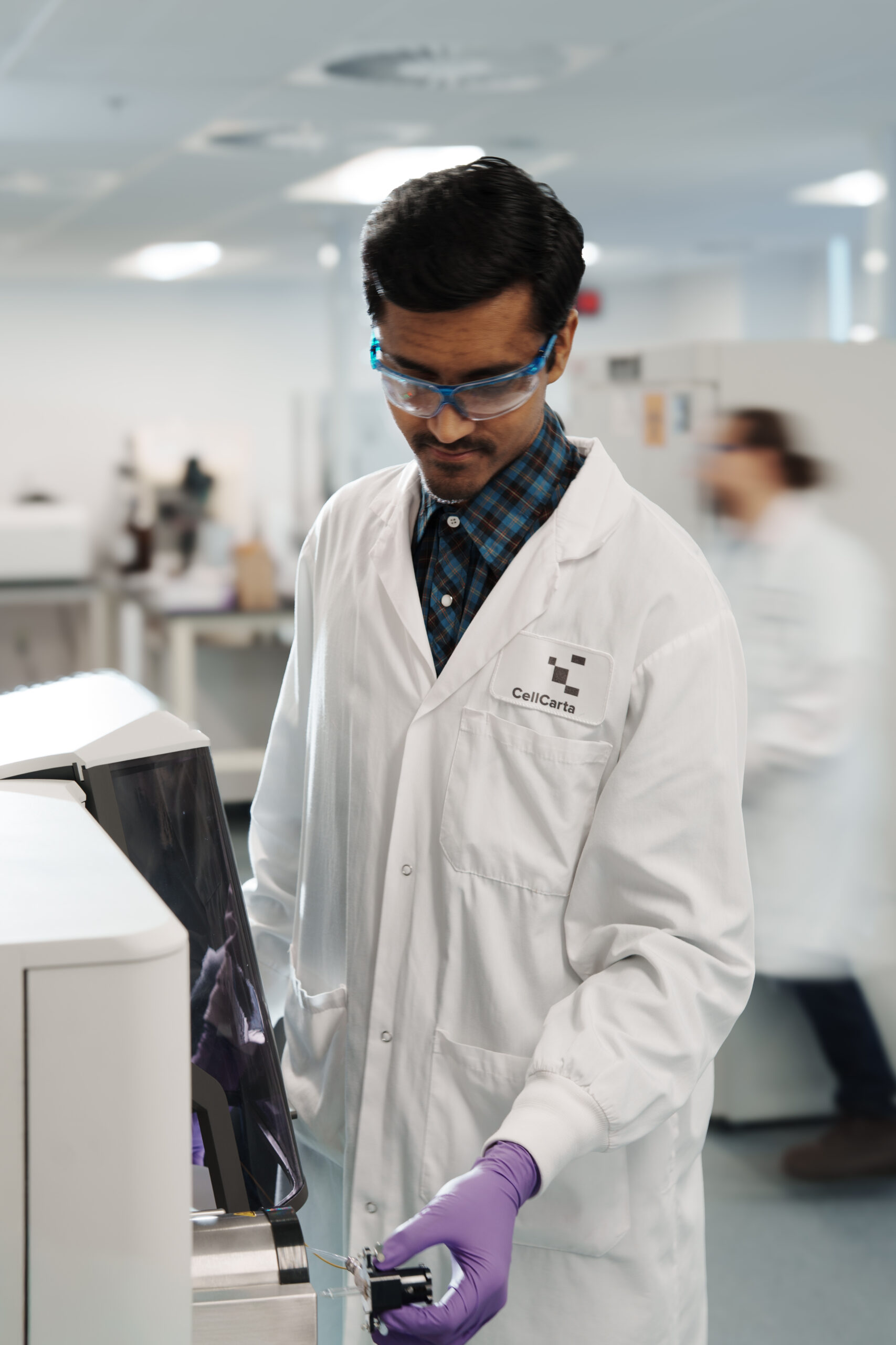 Scientist performing custom CyTOF antibody conjugation in CellCarta laboratory