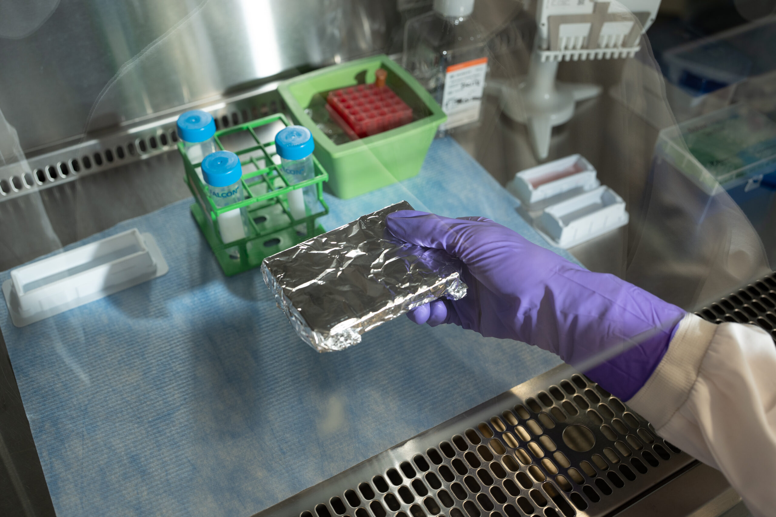 Scientist preparing diverse clinical sample types for flow cytometry analysis