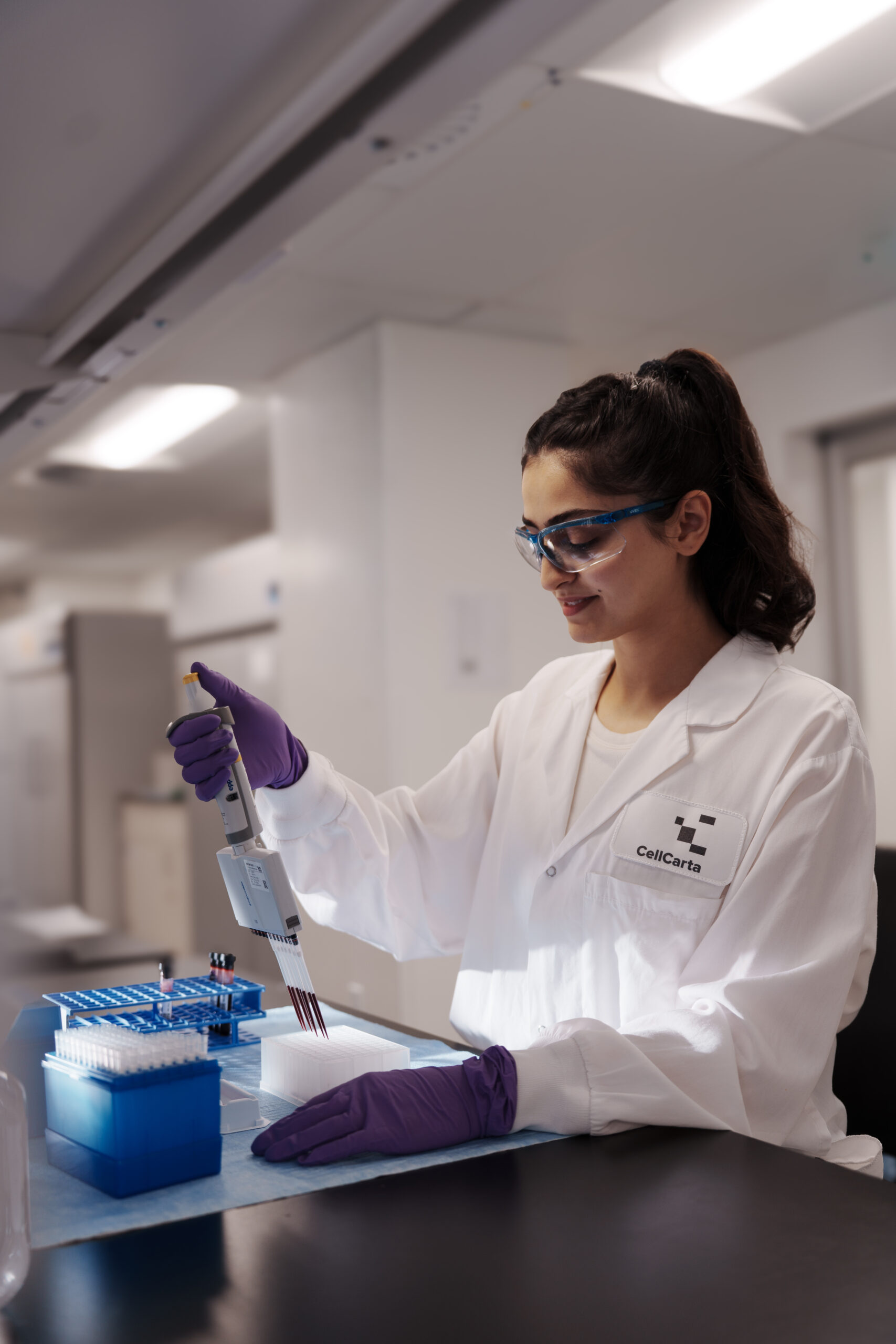 Scientist processing a sample at the laboratory bench.