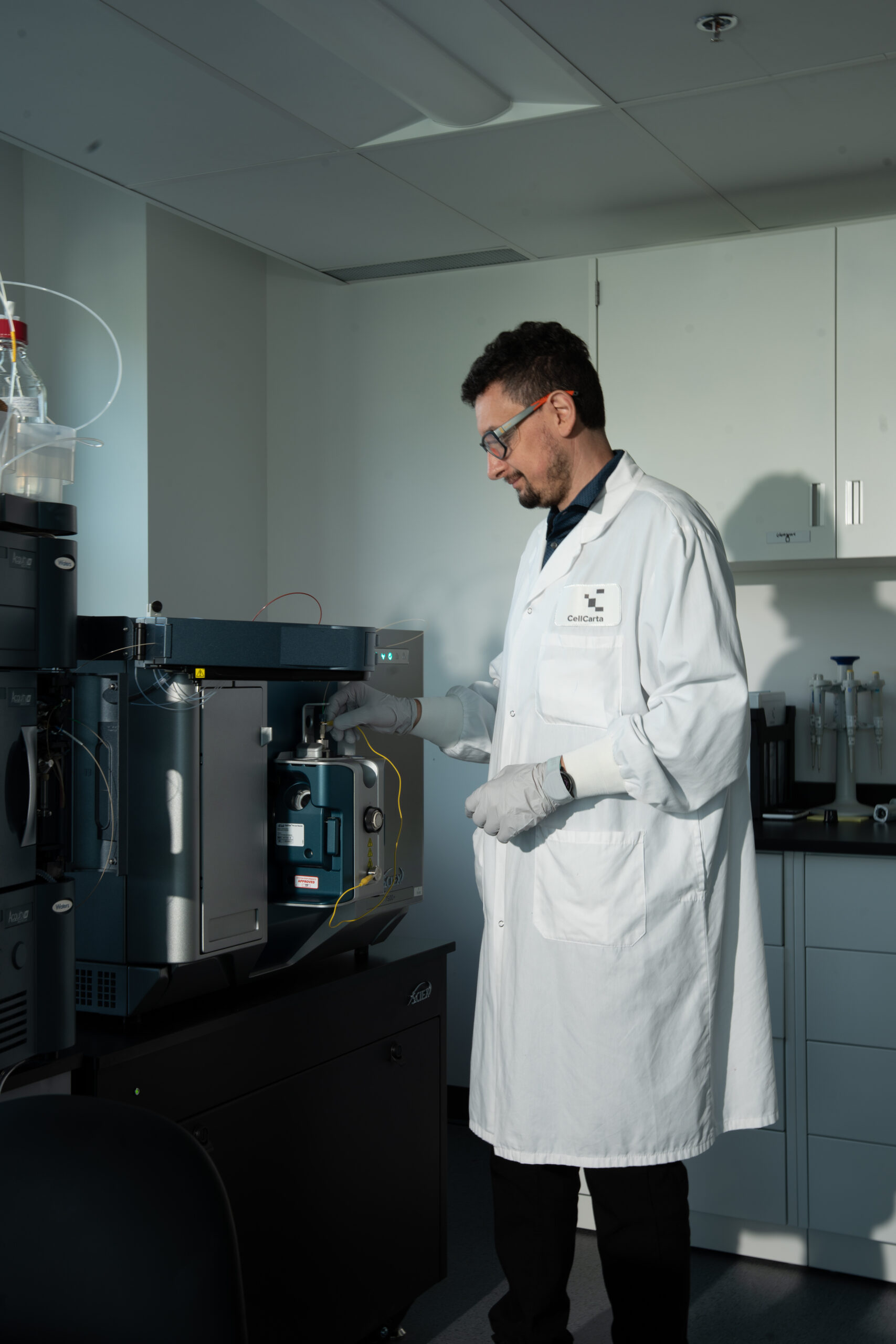 Scientistperforming analysis on Sciex mass spectrometry instrument.