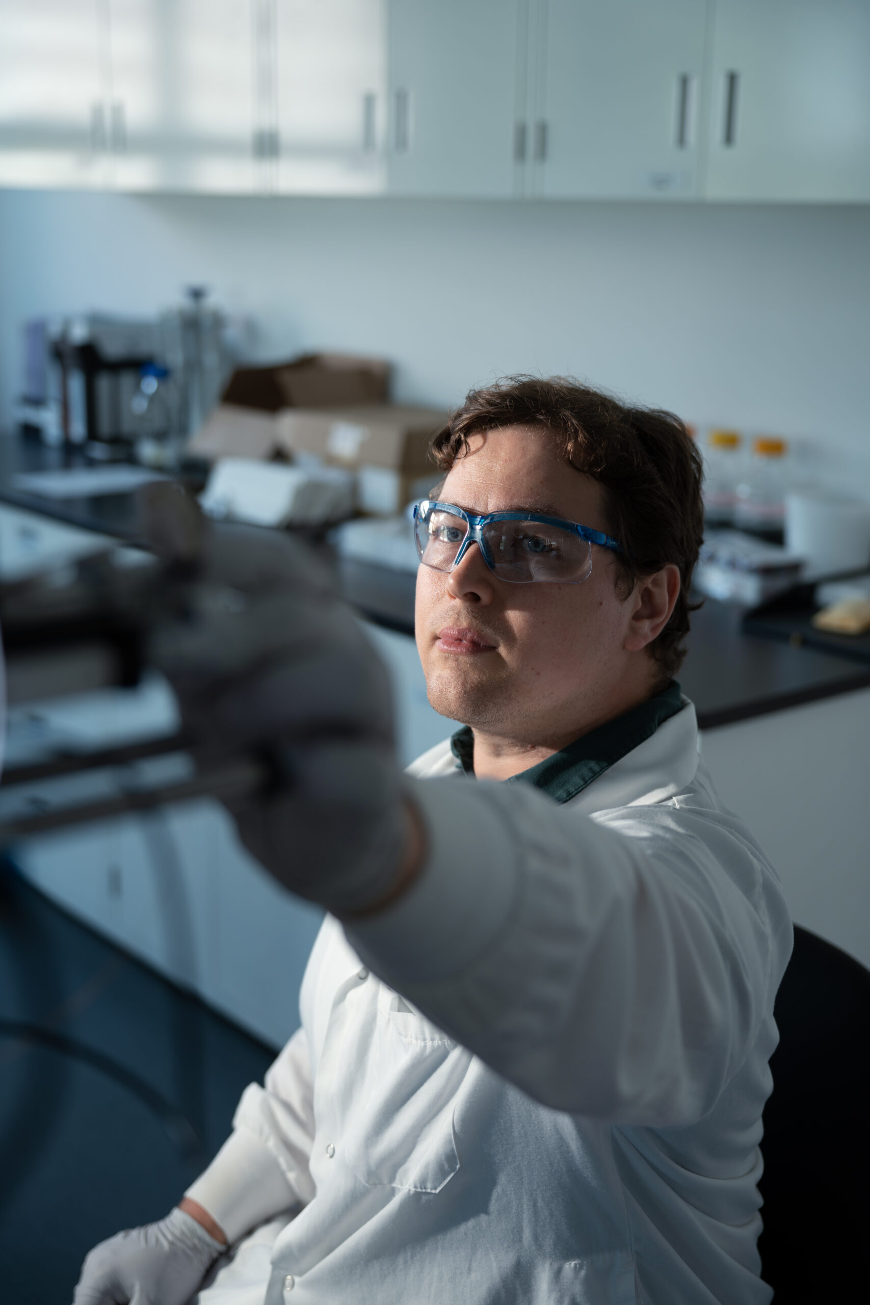 Scientist operating LC-MS/MS instrument for unbiased proteomics profiling