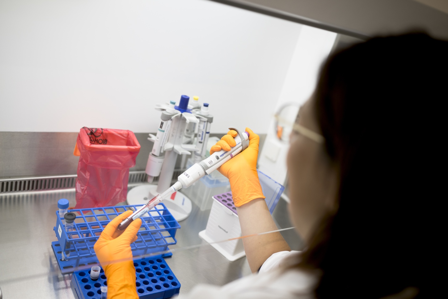 Scientist performing multiplexed mass spectrometry analysis of post-translational modifications in clinical samples